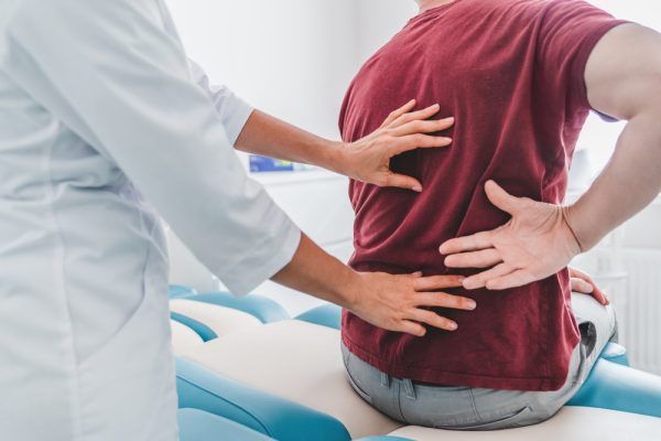 Medical professional at Ohr Medical examining a patient's back